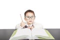 School child boy in glasses studying book Royalty Free Stock Photo