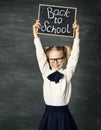 School Child holding Blackboard with Chalk Draw, Back to School, over Black Background, Advertising Girl