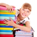 School child holding stack of books.