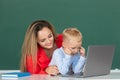 School child learning education online lesson. Elementary school classroom. Teacher and schoolchild pupil in class Royalty Free Stock Photo