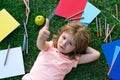 School Child thumbs up on nature. Distance learning. A boy kid is studying remotely outdoor in park. Home education and Royalty Free Stock Photo