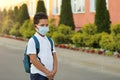 School child wearing face mask during corona virus and flu outbreak Royalty Free Stock Photo