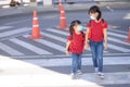 School child wearing a face mask during coronavirus and flu outbreak. sibling girl going back to school after covid-19 quarantine Royalty Free Stock Photo