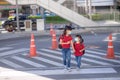 School child wearing a face mask during coronavirus and flu outbreak. sibling girl going back to school after covid-19 quarantine Royalty Free Stock Photo