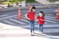 School child wearing a face mask during coronavirus and flu outbreak. sibling girl going back to school after covid-19 quarantine Royalty Free Stock Photo