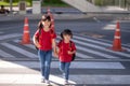 School child wearing a face mask during coronavirus and flu outbreak. sibling girl going back to school after covid-19 quarantine Royalty Free Stock Photo