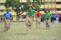 School children competing in sack race
