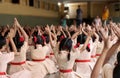 School children doing yoga with the teachers