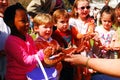 School children hold a corn snake Royalty Free Stock Photo