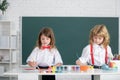 School children girl and boy painting with paints color and brush in classroom. Kids art, creativity children concept. Royalty Free Stock Photo