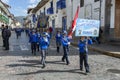 School children parade through the streets of Cusco in Peru.