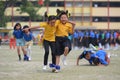 School children compete in three legged race