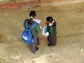 School children reading on the way to school to prepare for examinations Royalty Free Stock Photo