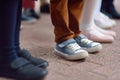 School children`s feet wearing comfortable shoes. Kids boots. Parent`s care before school year. Back to school Royalty Free Stock Photo