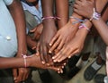 School children show their new friendship bracelets.