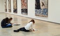 School children sketching on the floor of art exhibition in Haus der Kunst, Munich Germany. Educational arts project.