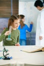 School children and teacher in science class Royalty Free Stock Photo