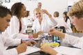 School children and their teacher in science class Royalty Free Stock Photo