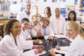 School children and their teacher in science class Royalty Free Stock Photo