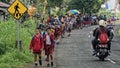 School children on road, Bali, Indonesia