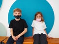 School children wearing face mask during corona virus and flu outbreak. Boy and girl going back to school after covid-19 Royalty Free Stock Photo