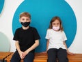 School children wearing face mask during corona virus and flu outbreak. Boy and girl going back to school after covid-19 Royalty Free Stock Photo