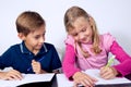 School children writing together Royalty Free Stock Photo