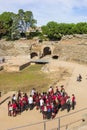 School class getting a tour in the roman theater of Merida