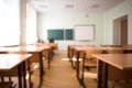 School classroom in blur background without young student.