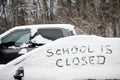 School is closed text, hand written in fresh snow on an automobile window Royalty Free Stock Photo