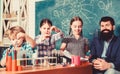 After school clubs. School chemistry experiment. Explaining chemistry to kid. Fascinating chemical reaction. Teacher and