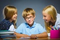 School Communication concept. girls talking to boy Royalty Free Stock Photo
