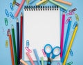 School composition with school stationery and blank notepad. Flatlay. Mockup. Top view. Place for text