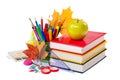 School concept - books, leaves, apple and stationery isolated Royalty Free Stock Photo