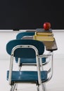 School Desks With Books And Apple.