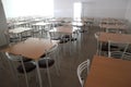 School dining room with a lot of tables and chairs