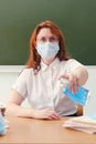 The school doctor is cleaning his hands with antibacterial soap. Education problems during coronavirus quarantine and new normal Royalty Free Stock Photo