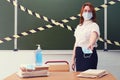 School doctor handing out medical masks in the classroom. Education problems during the coronavirus quarantine Royalty Free Stock Photo