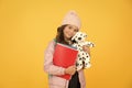 School and education. Care and treatment of animals. Studying veterinary medicine. Happy child hold toy dog and books Royalty Free Stock Photo