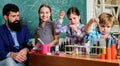 School education. School club. Explaining chemistry to kid. Fascinating chemical reaction. Teacher and pupils with test