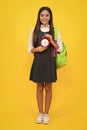 School and education concept. Back to school. Schoolchild, teenage student girl with clock alarm, time to study. Happy Royalty Free Stock Photo