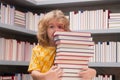 School and education concept. Child at school. Schoolboy reading book in library. Kids development. Pupil learn to read Royalty Free Stock Photo