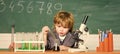 School education. Explore biological molecules. Toddler genius baby. Technology and science concept. Boy near microscope