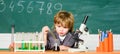 School education. Explore biological molecules. Toddler genius baby. Technology and science concept. Boy near microscope