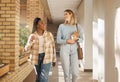 School, education and university students, women or people walking to class in campus community and laughing. Diversity Royalty Free Stock Photo