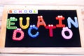 SCHOOL EDUCATION WRITTEN WITH BLOCK LETTERS ON CHALKBOARD Royalty Free Stock Photo