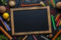 School essentials writing board and stationery on black background Royalty Free Stock Photo