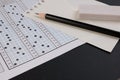 School exam answer sheet and pen. Standard test form or answer sheet. Answer sheet focus on pencil. Royalty Free Stock Photo
