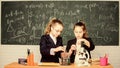 School experiment. Science concept. Gymnasium students with in depth study of natural sciences. Girls school uniform