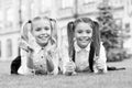 School friends formal clothes relaxing on green grass, child care concept Royalty Free Stock Photo